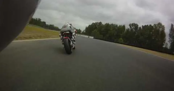 MotoCzysz E1pc Testing Quentin Wilson following on a Ducati