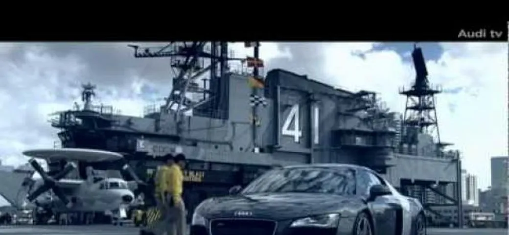 Video: Audi R8 VS Zivko Edge 540 Red Bull; drag race sulla portaerei Midway