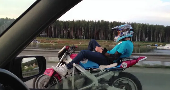 Motorcyclist Answers Text during Ride