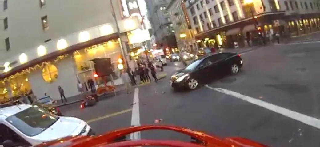 The death of my D675 and birth of my Ninja skills:  Idiot cager blows red light