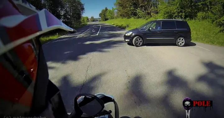 Near horrible motorcycle crash with stupid car driver